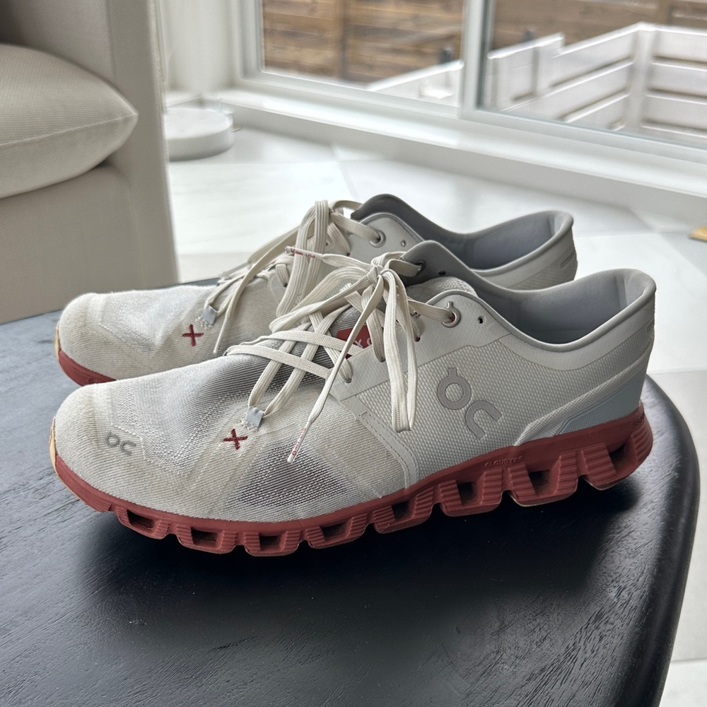 On Running White and Red Athletic Shoes